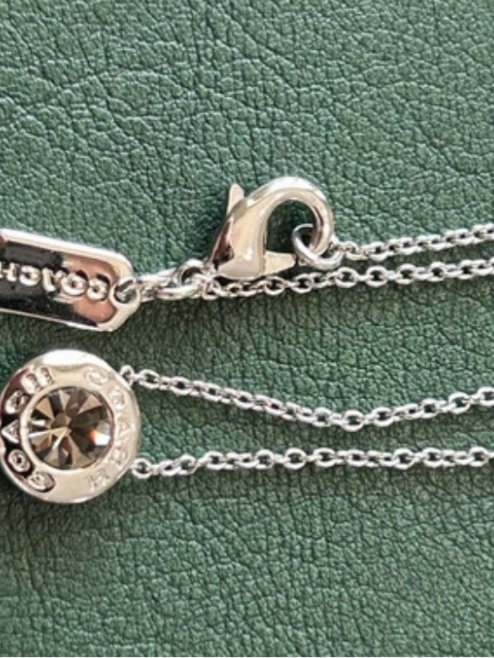 Coach Silver-Tone Crystal Disc Pendant Necklace